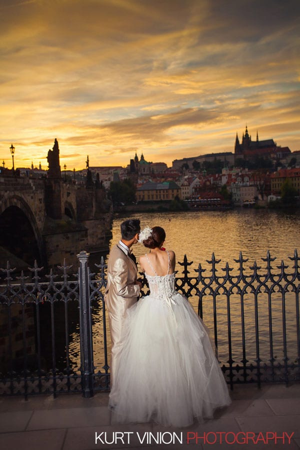 good looking couple, wedding dress, sunset, Prague Castle, Charles Bridge, water reflections