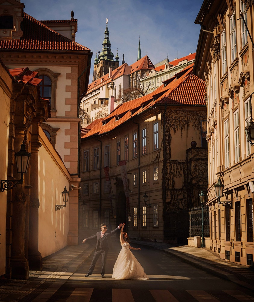 Prague golden light hour beautiful photo of couple dancing under the castle