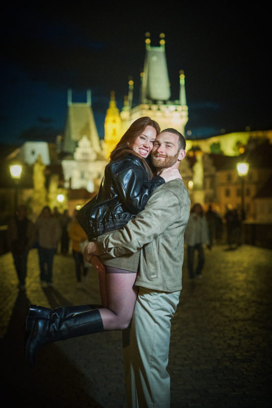 Max and Bryanna celebrate their engagement atop the Charles Bridge in Prague.