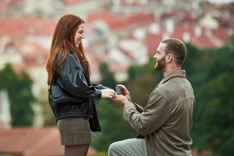 Close up of Bryanna's smile as she reaches for the diamond engagement ring from Max.