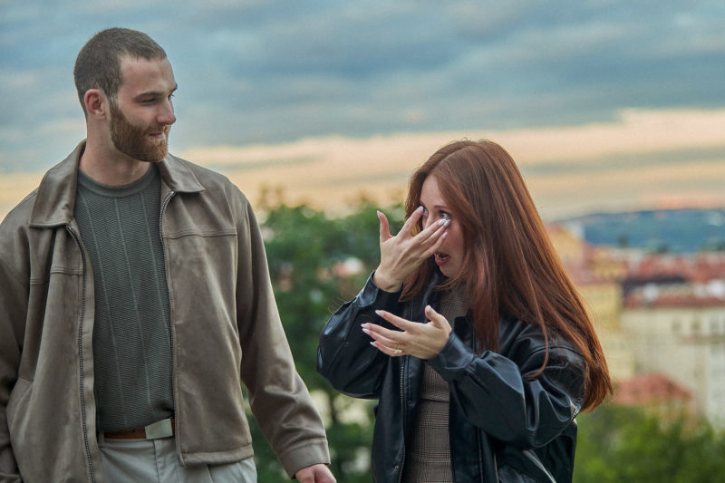 Bryanna wipes a tear from her eye as Max looks on seconds after accepting his marriage proposal.