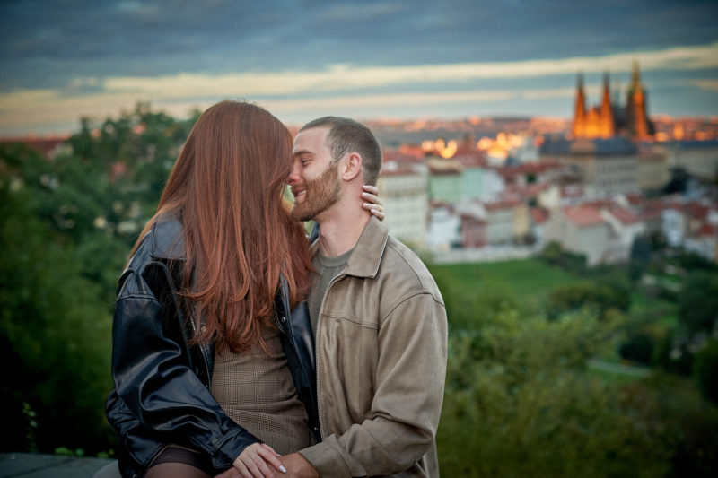 Bryanna and Max share a sexy embrace above the medieval City of 100 Spries.
